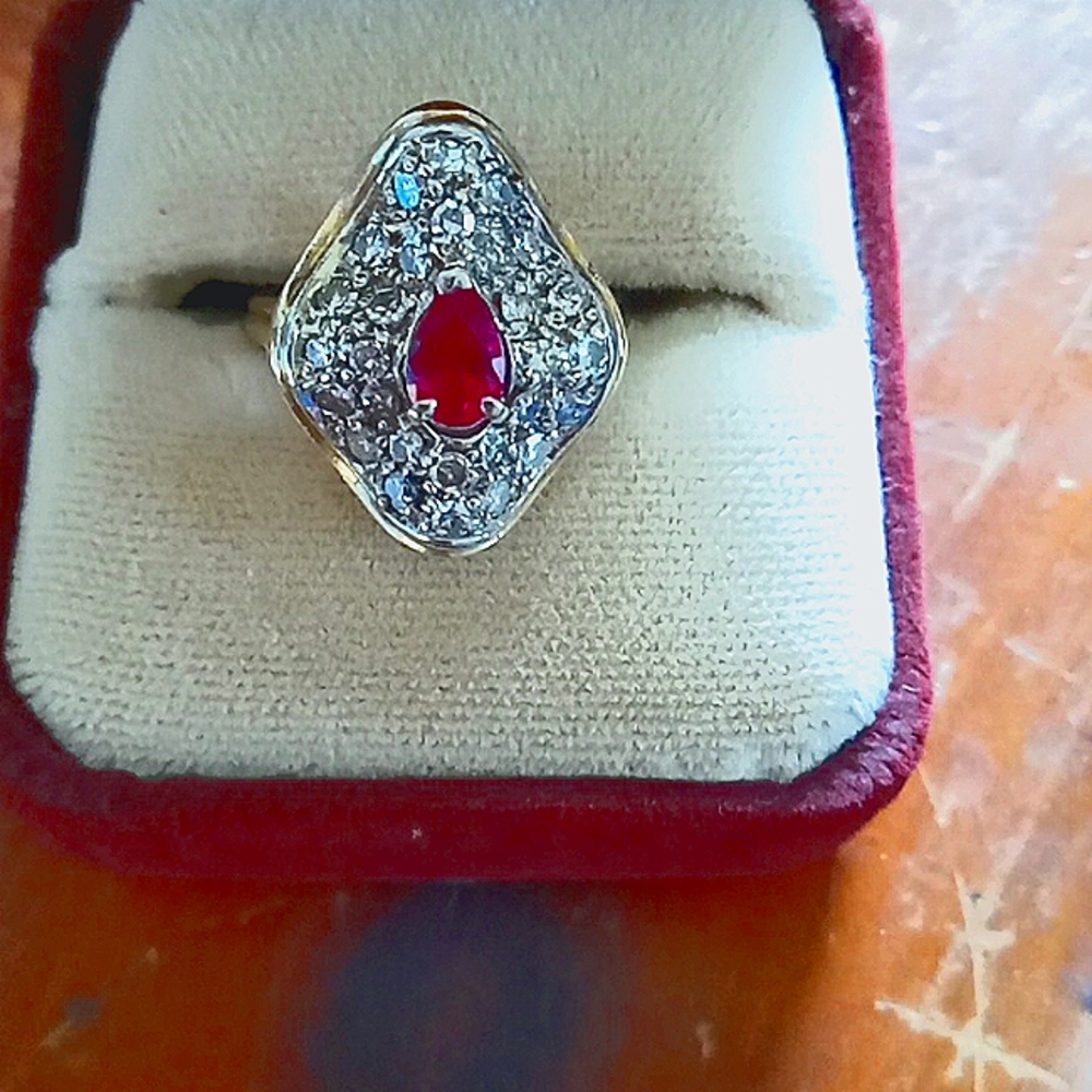 Beautiful Filigree Pear Shaped Ruby and  Diamondin White Gold Wave Ring